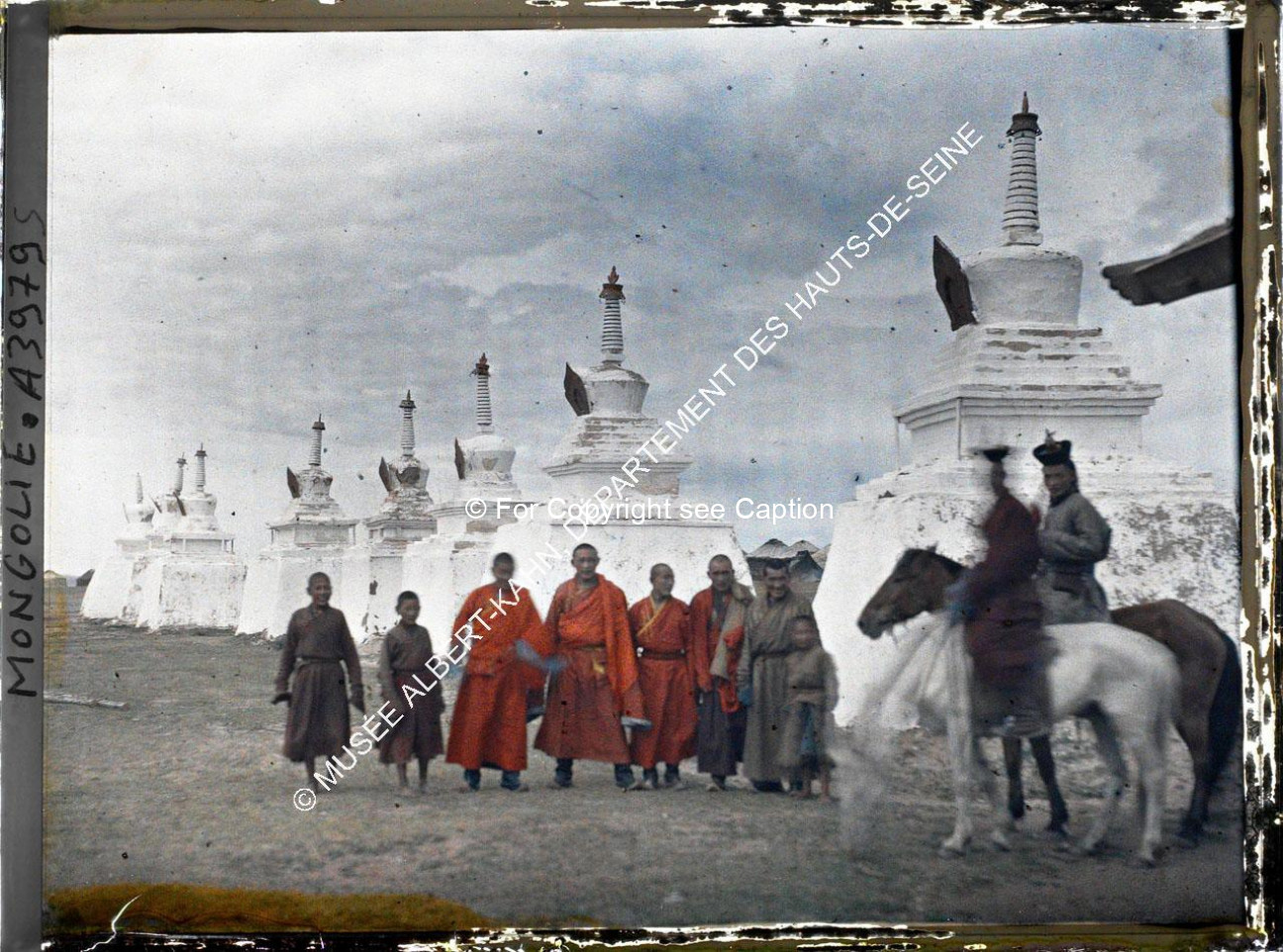 A group of monks in front of Gandan's stupas. Musée Albert-Kahn. A3979S. Photo by Stéphane Passet, 2